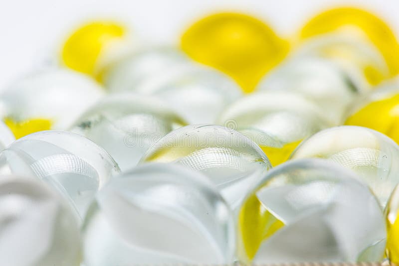 Yellow and White Glass Marbles on a Table Stock Photo Image of blue, green 168646558