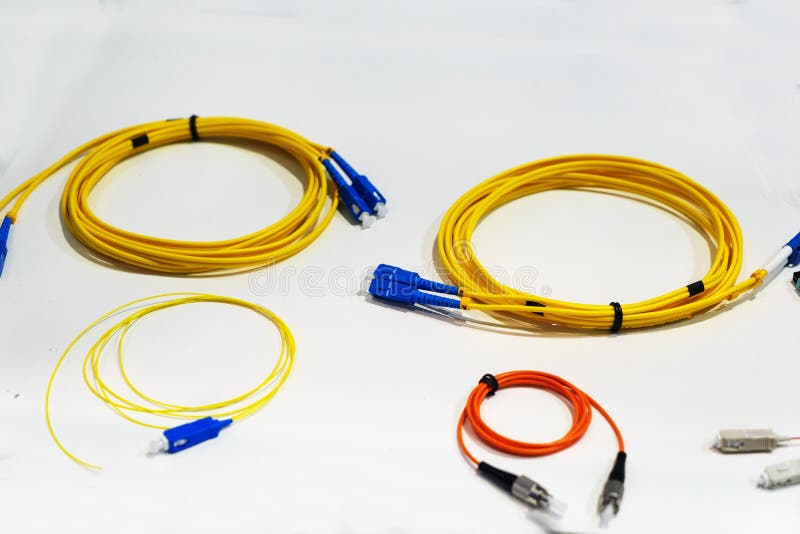 Yellow wire cable with the blue end caps on a white background.