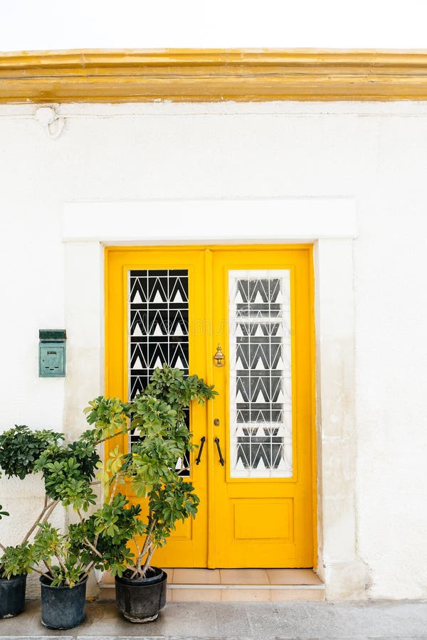 Yellow wooden door, mediterranean style