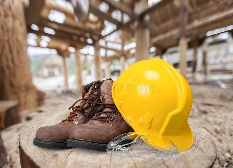 Yellow Working Hard Hat and Work Boots on Wooden Stock Image Image of