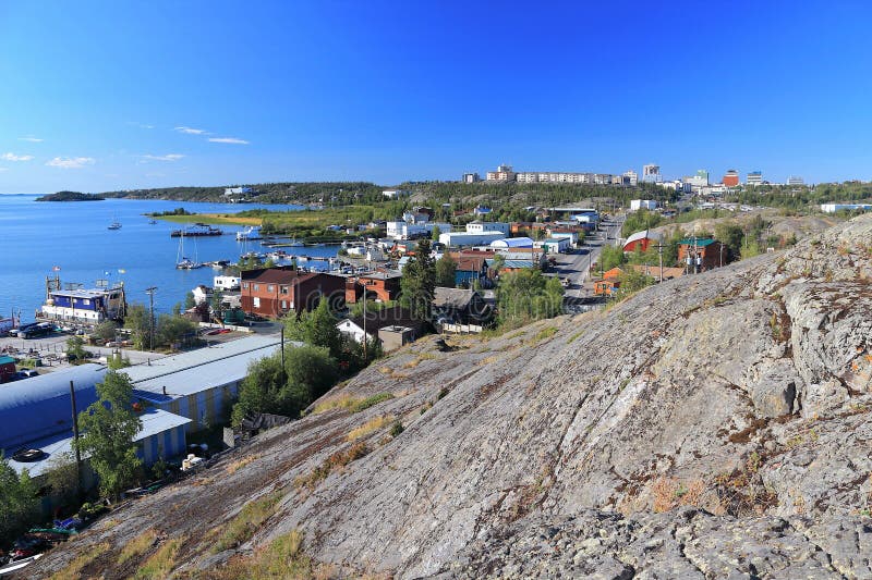 Panorama from the Bush Pilots Monument that was erected atop a granite rock outcropping of the Canadian Shield, offering great views of Old Town, the newer downtown skyline, and the north arm of Great Slave Lake at Yellowknife, Northwest Territories, Canada. Panorama from the Bush Pilots Monument that was erected atop a granite rock outcropping of the Canadian Shield, offering great views of Old Town, the newer downtown skyline, and the north arm of Great Slave Lake at Yellowknife, Northwest Territories, Canada.