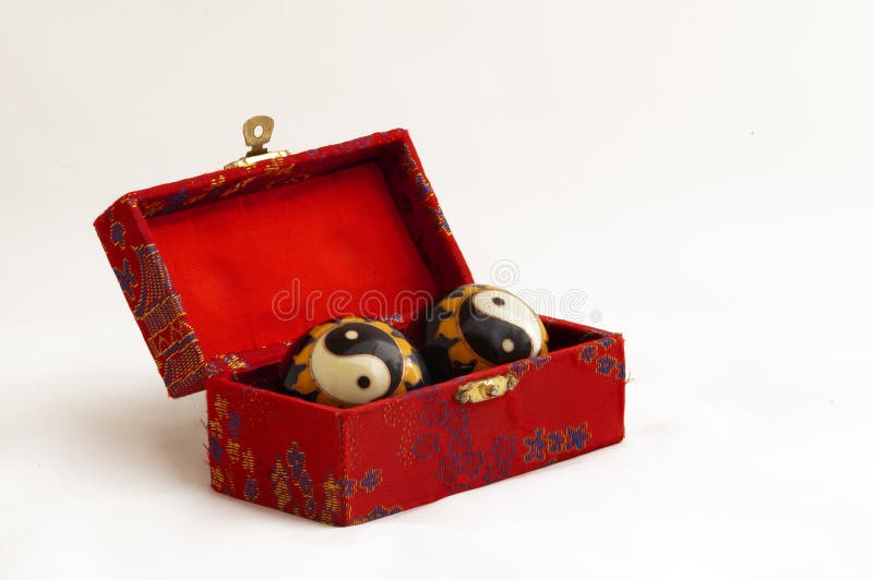 Yin yang balls in a red box