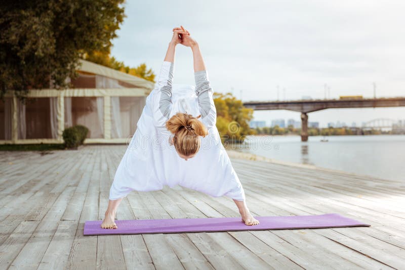 Young Woman Stretching Her Back Muscles with Yoga Exercises Stock Image ...