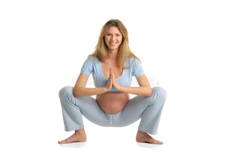 Yoga de pratique de femme enceinte, restant image libre de droits Yoga de pratique de femme enceinte, restant image libre de droits