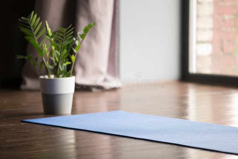 Yoga mat on the floor, blue carpet stock images Yoga mat on the floor, blue carpet stock images
