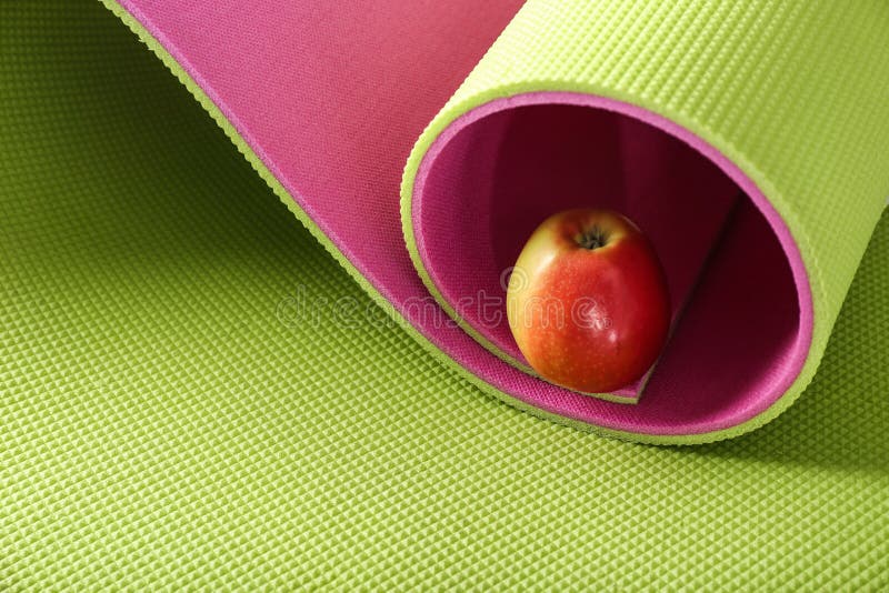 Yoga mat with fresh apple stock image. Image of sport 151243925