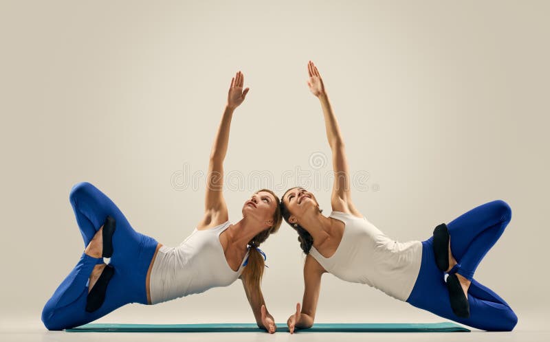 Yoga Pair Women Duo Balance Stock Photos - Free & Royalty-Free Stock Photos  from Dreamstime