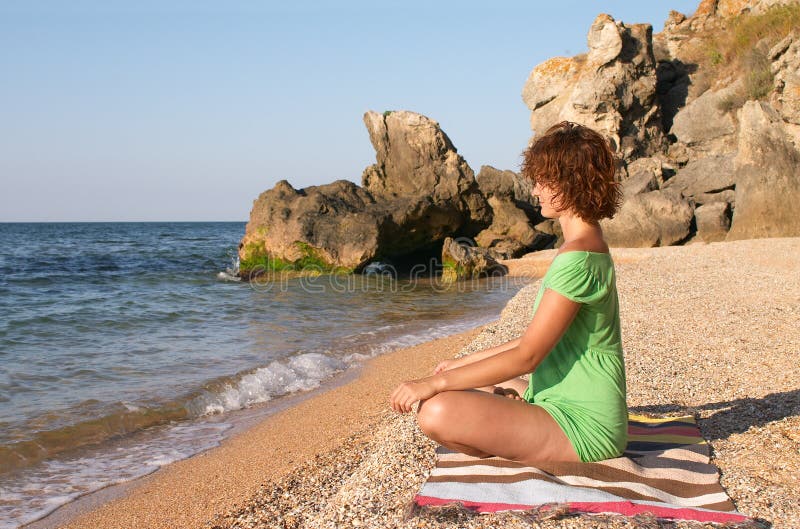 Yoga practise on the beach royalty free stock images