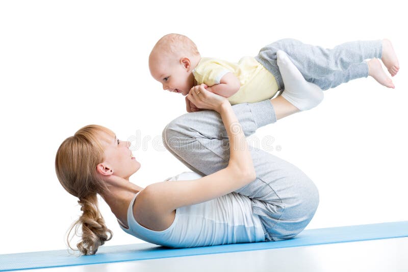 Young happy mother working out, doing butt bridge exercise