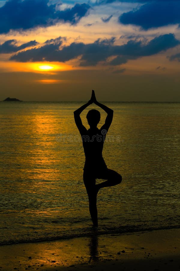 Meditation, serenity and yoga practicing at sunset.Silhouette meditation  girl on the background of the stunning sea and sunset. yoga poses fitness.  Calm and self-control. copy space for advertising Stock Photo | Adobe