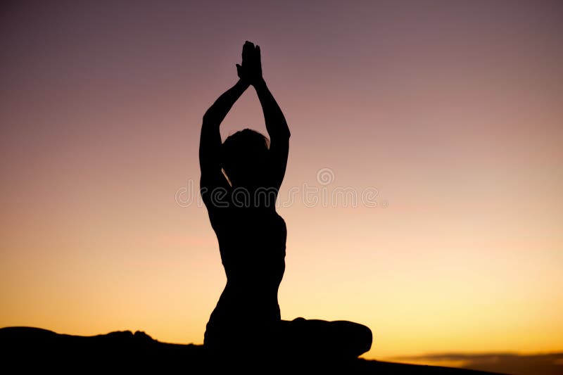 Yogi Master Silhouette on the beach stock photo