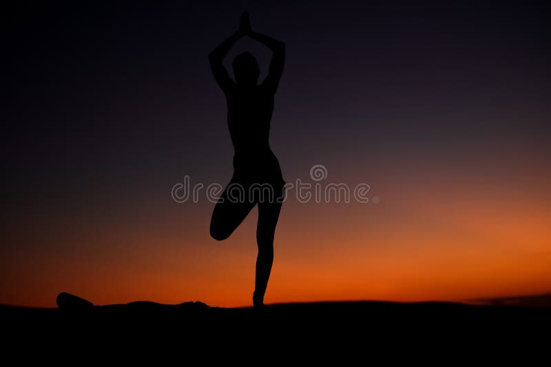 Yogi Master Silhouette on the beach stock photo