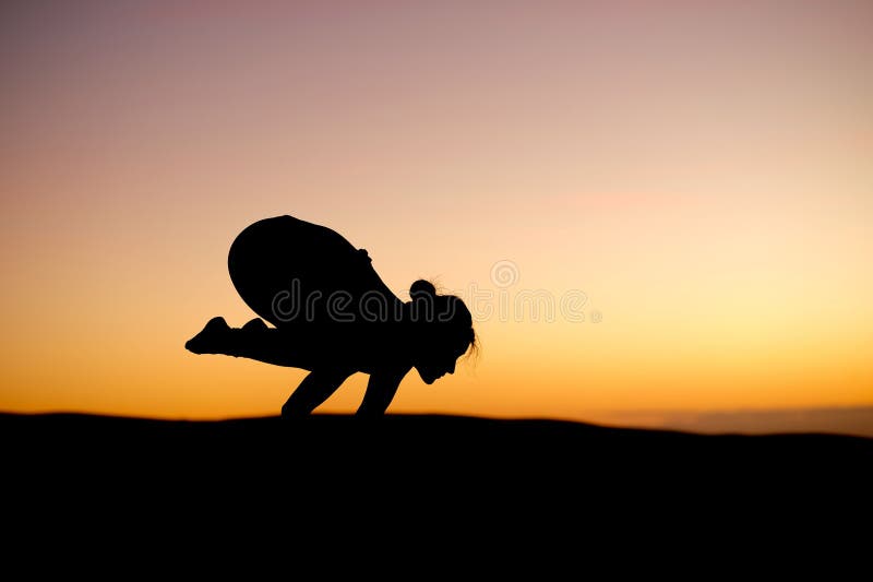 Yogi Master Silhouette on the beach stock images
