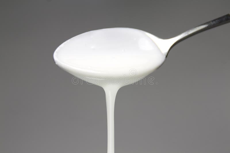 Spoon of yogurt stock photo. Image of isolated, food 18334694