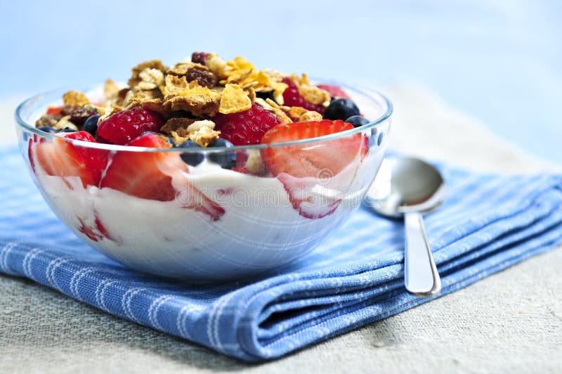 Yogurt with berries and granola royalty free stock photography