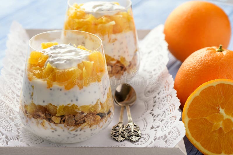 Yogurt Dessert with Muesli, Chia Seeds and Oranges. Stock Photo Image