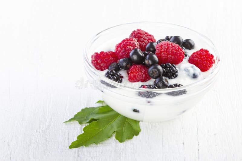 Yogurt with forest berries in bowl