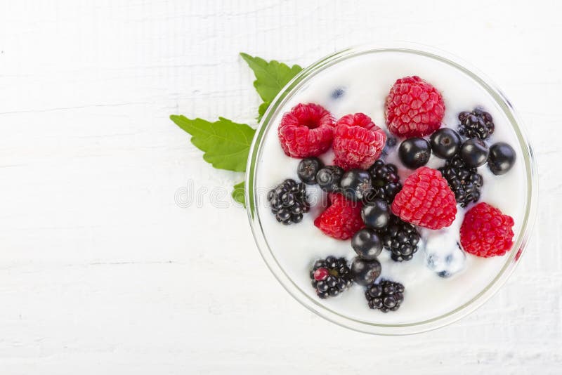 Yogurt with forest berries in bowl