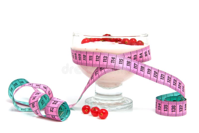 Glass bowl with yogurt,berrie fruit and measure tape for dieting over white background. Glass bowl with yogurt,berrie fruit and measure tape for dieting over white background