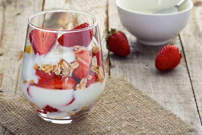 Yogurt with muesli and strawberries royalty free stock photography Yogurt with muesli and strawberries royalty free stock photography