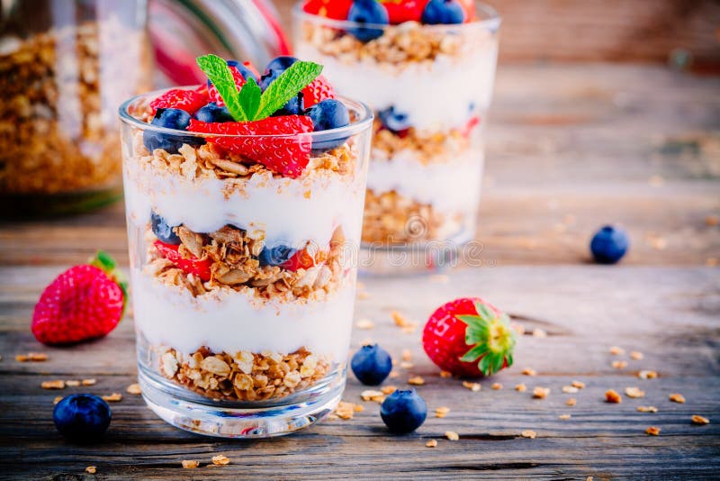 Yogurt parfait with granola, strawberries and blueberries