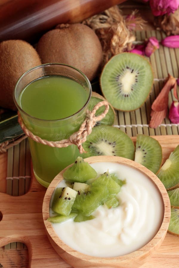 Yogurt White with Green Kiwi Fruit and Kiwi Juice. Stock Photo Image