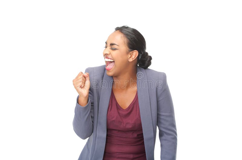 Happy young woman celebrating with fist pump on isolated white background.