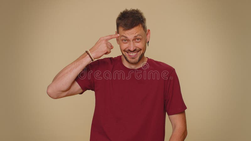 Screw You Idiot Upset Guy In Tshirt Making Stupid Gesture Twisting Finger  Near Head And Expressing Disappointment Stock Video - Download Video Clip  Now - iStock