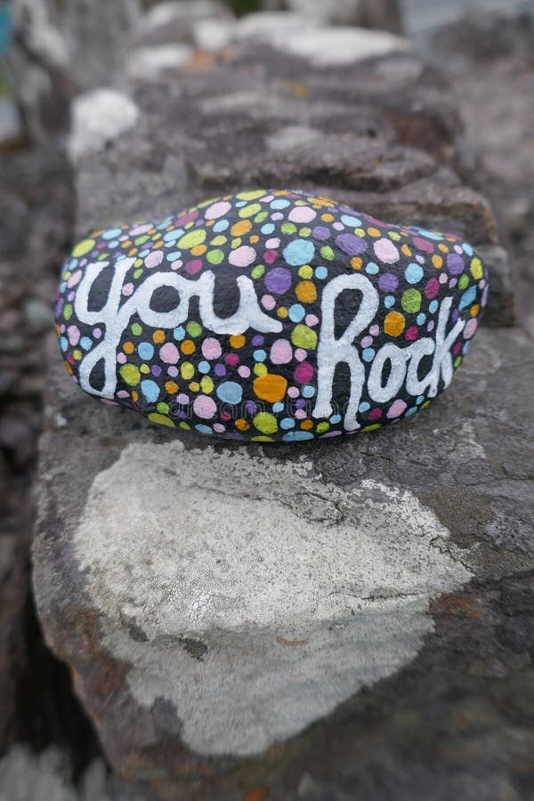 You Rock Written in Script on Polka Dot Kindness Rock Stock Image
