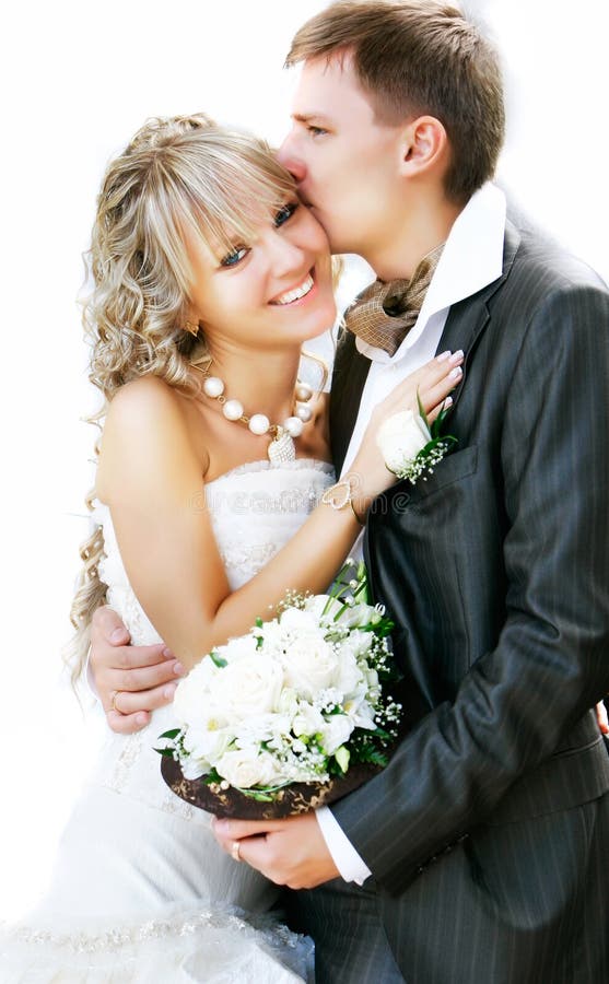 Young adorable bride and groom