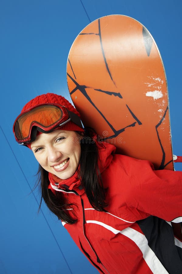 Young adult female snowboarder