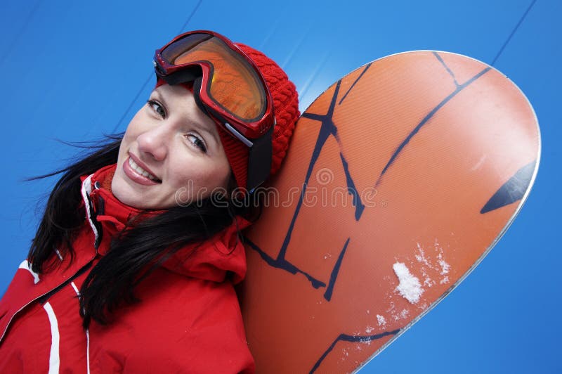 Young adult female snowboarder