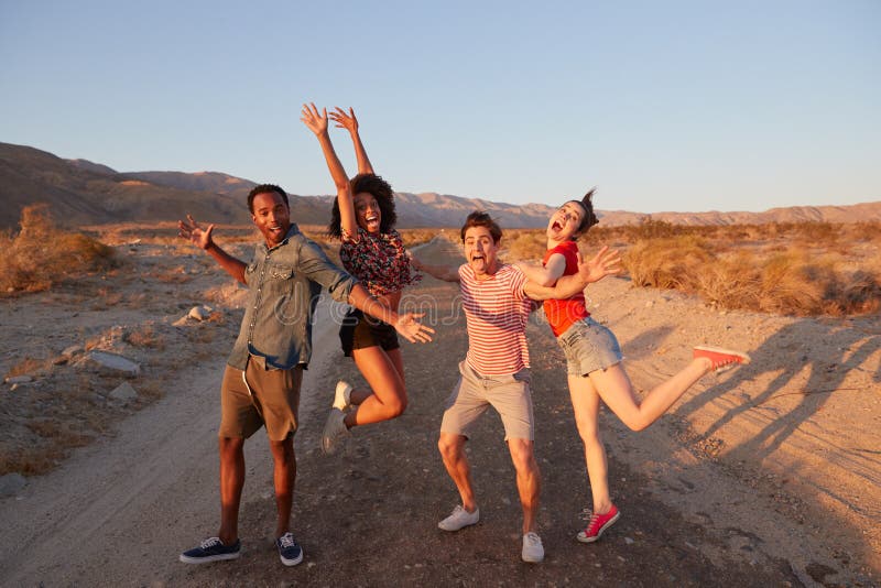 young adult friends have fun striking poses desert young adult friends have fun striking poses desert 136287330