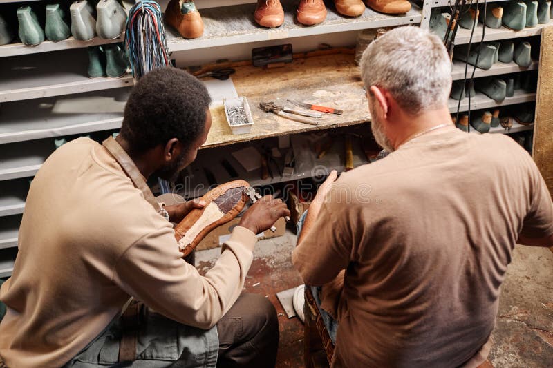 Young African American Apprentice of Shoemaker Fixing Upper Part of Boot Stock Photo Image of
