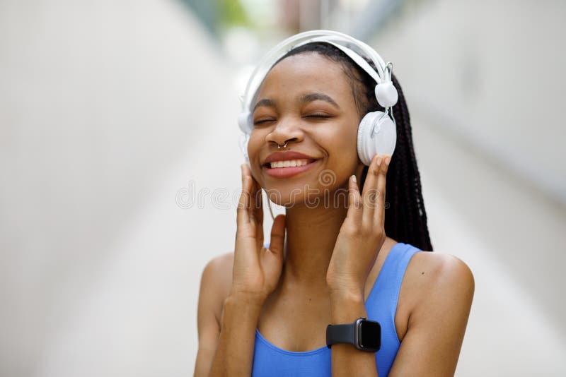 Young African American Athletic Woman Smiling Happily Wearing