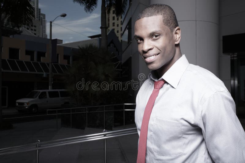 Young African American businessman smiling