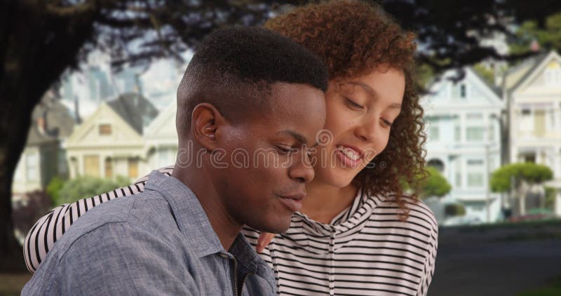 Young African American couple talk in a park royalty free stock photos Young African American couple talk in a park royalty free stock photos