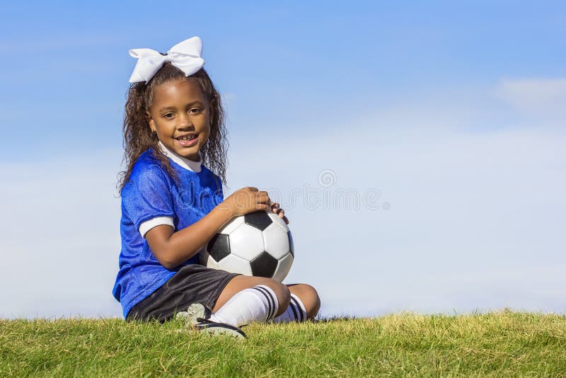 Young african american girl soccer player