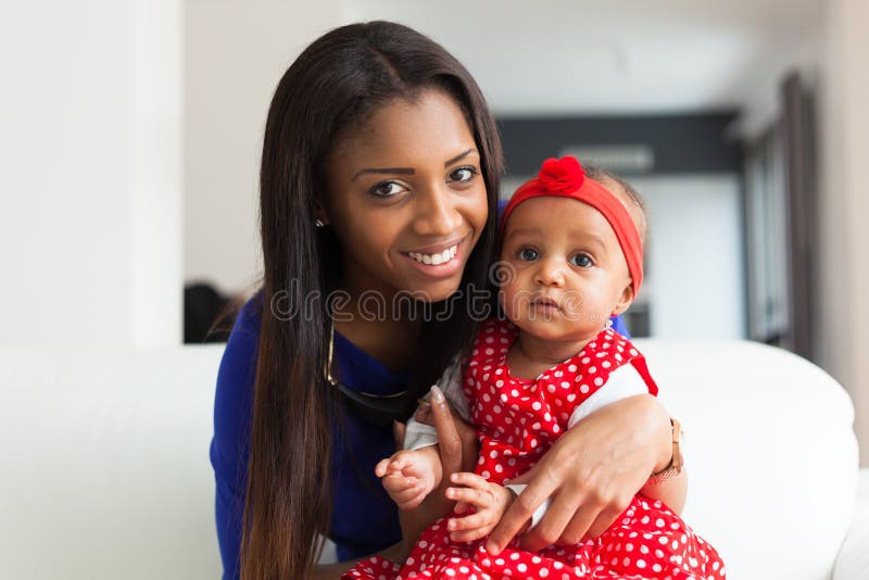 Young african american mother playing with her baby girl royalty free stock images Young african american mother playing with her baby girl royalty free stock images