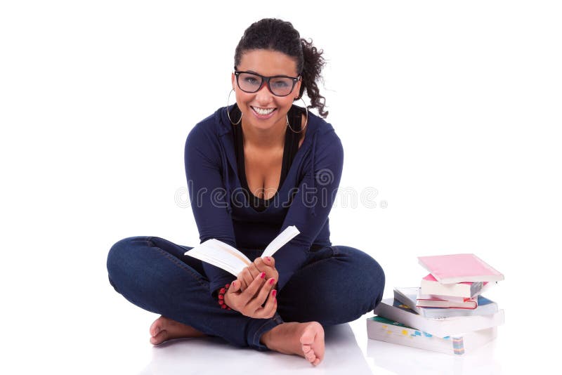 Young African American student girl reading a book