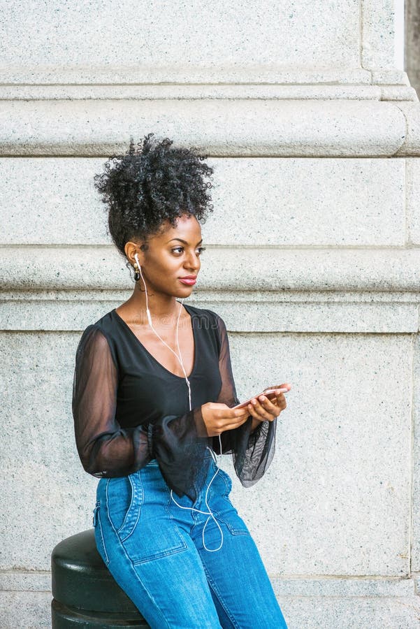 Young African American Woman with Afro Hairstyle Listening Music on Street  in New York City Stock Photo - Image of beautiful, minority: 155463074