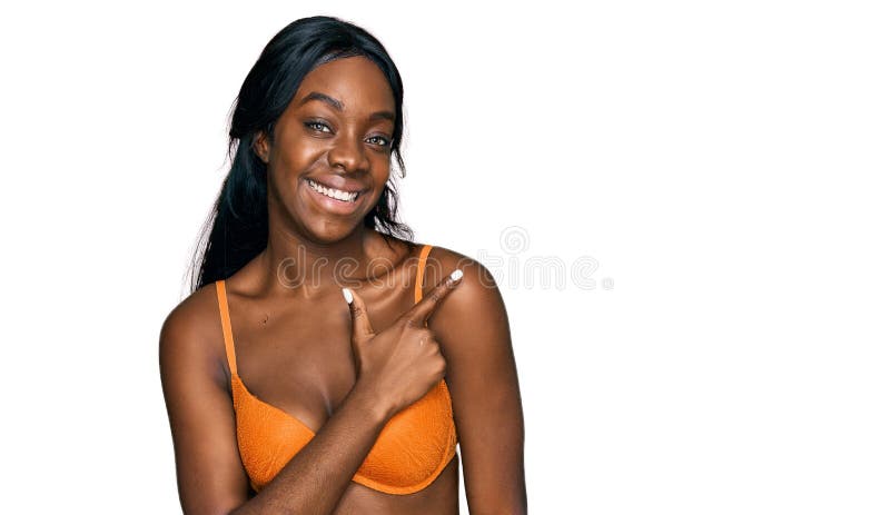 https://thumbs.dreamstime.com/b/young-african-american-woman-wearing-lingerie-cheerful-smile-face-pointing-hand-finger-up-to-side-happy-natural-225596763.jpg