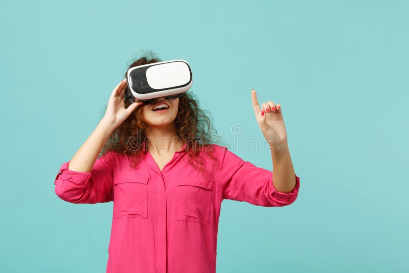Young african girl looking in headset, touch something like push click on button, pointing at floating virtual screen royalty free stock photo Young african girl looking in headset, touch something like push click on button, pointing at floating virtual screen royalty free stock photo