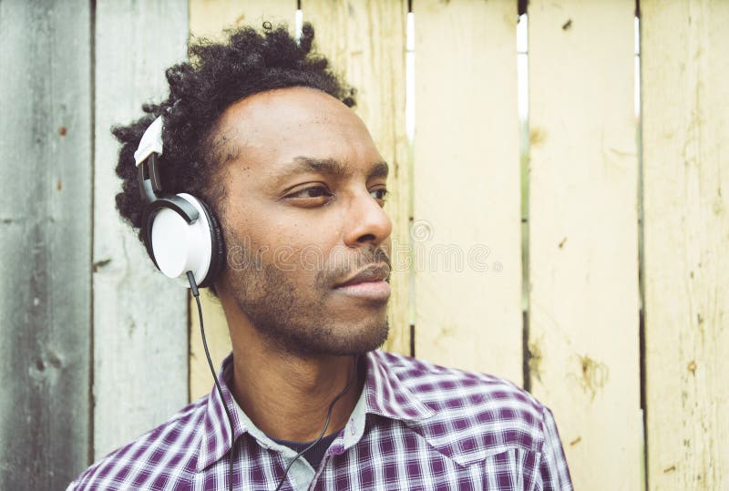 Young African Man Listening To Music Stock Image - Image of headphones ...