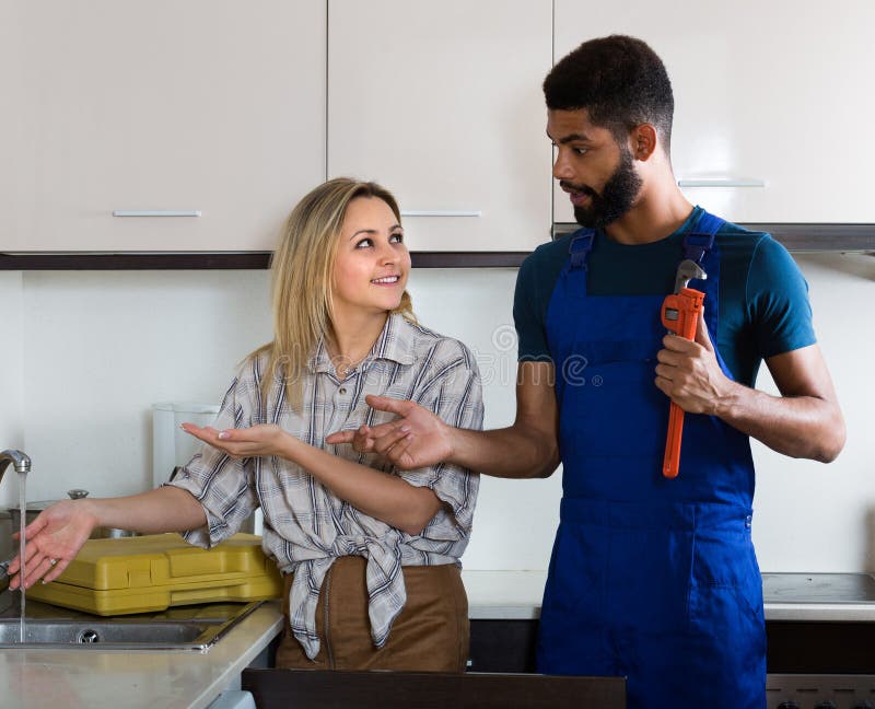 housewife plumber in kitchen