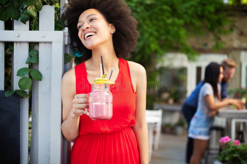 Young african woman enjoy healthy vegetarian smoothie for weight loss royalty free stock photography Young african woman enjoy healthy vegetarian smoothie for weight loss royalty free stock photography