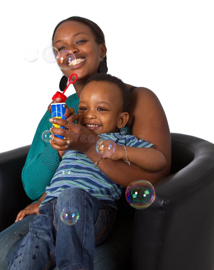 Young afro american family with bubbles