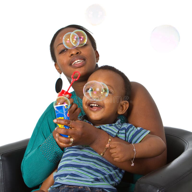 Young afro american family with bubbles