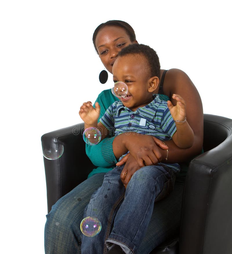 Young afro american family with bubbles