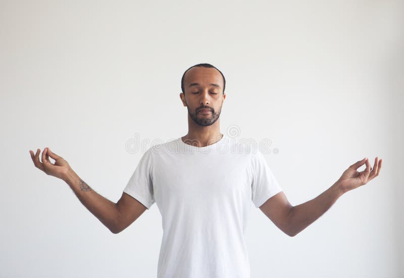 Young afro man concentrating his mind, meditating, yoga exercise breath technique reduce stress. Lifestyle concept. Exercise technique stock images, royalty-free photos and pictures
